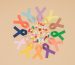 flat lay with arranged pills and colorful ribbons around isolated on beige tabletop, world health